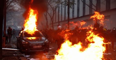 A car burns during a protest against the "Global Security Bill," Paris, Dec. 5, 2020. (Reuters Photo)