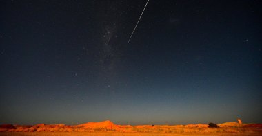 JAXA's Hayabusa-2 probe's sample drop to earth after landing on and gathering material from an asteroid some 300 million kilometers from Earth is seen from Coober Pedy in South Australia on Dec. 6, 2020.  (AFP Photo)