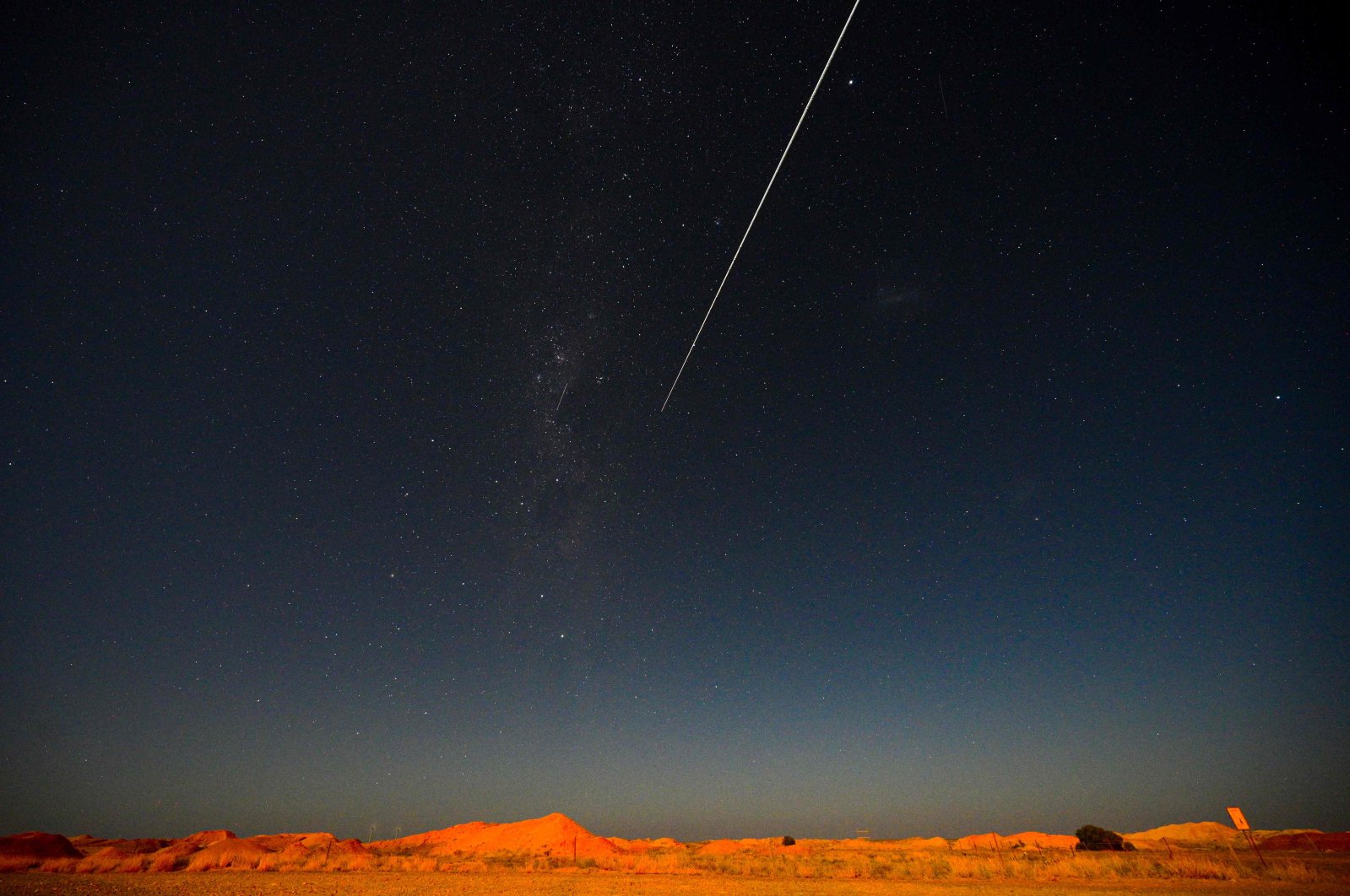 JAXA's Hayabusa-2 probe's sample drop to earth after landing on and gathering material from an asteroid some 300 million kilometers from Earth is seen from Coober Pedy in South Australia on Dec. 6, 2020.  (AFP Photo)