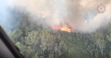 An aerial view shows bushfires on Fraser Island, Queensland, Australia, in this still image taken from video released on December 2, 2020. (Queensland Fire and Emergency Services/via Reuters)