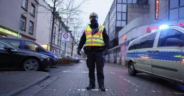 A policeman at the scene after a bomb was found in a residential area in the Gallus district of Frankfurt, Germany, Dec. 6, 2020. (AP Photo)