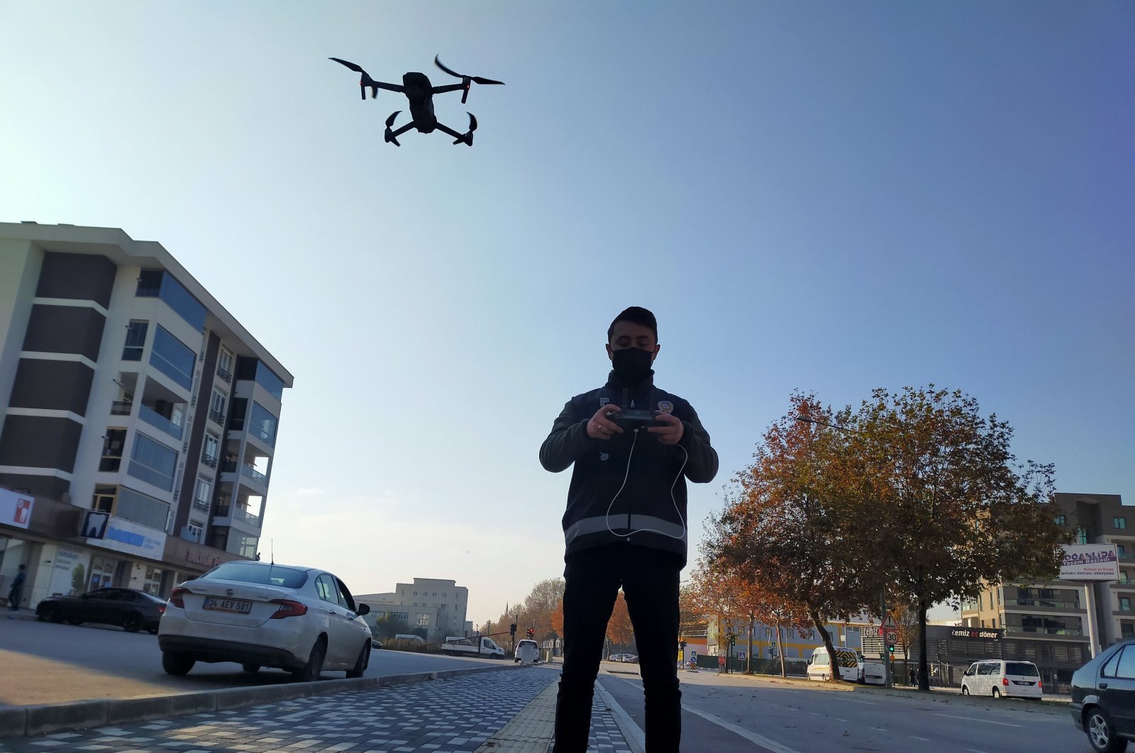 A police officer uses a drone to monitor a weekend curfew in Turkey's Bursa province on Dec. 6, 2020. (DHA Photo)