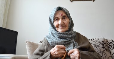 Huriye Başkapan poses for a photo at her home in Istanbul, Turkey, Dec. 7, 2020. (AA Photo)