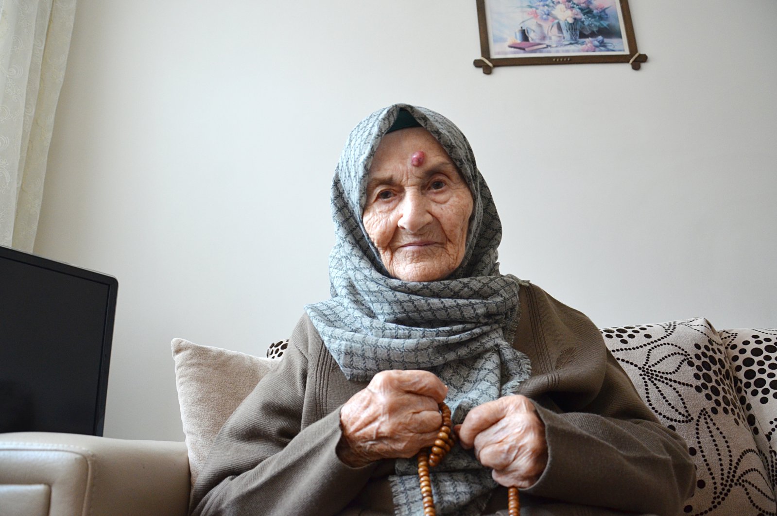 Huriye Başkapan poses for a photo at her home in Istanbul, Turkey, Dec. 7, 2020. (AA Photo)