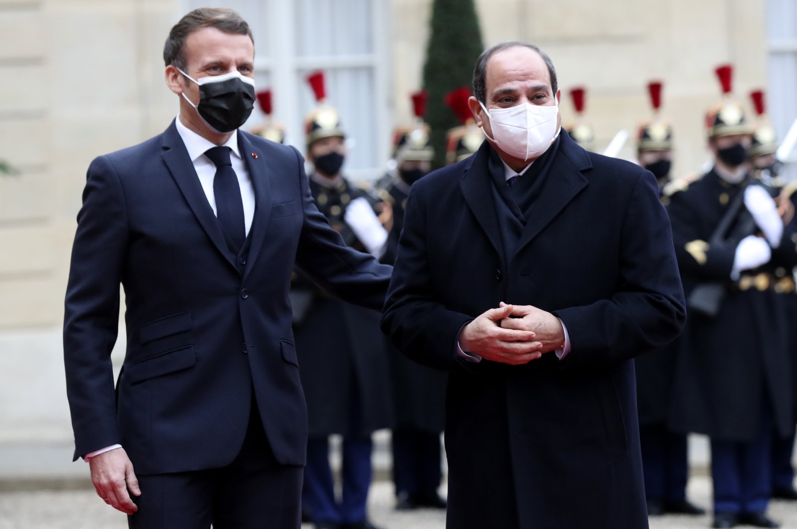 French President Emmanuel Macron welcomes Egyptian President Abdel-Fattah el-Sissi at the Elysee Palace, Paris, France, Dec. 7, 2020. (AP Photo)