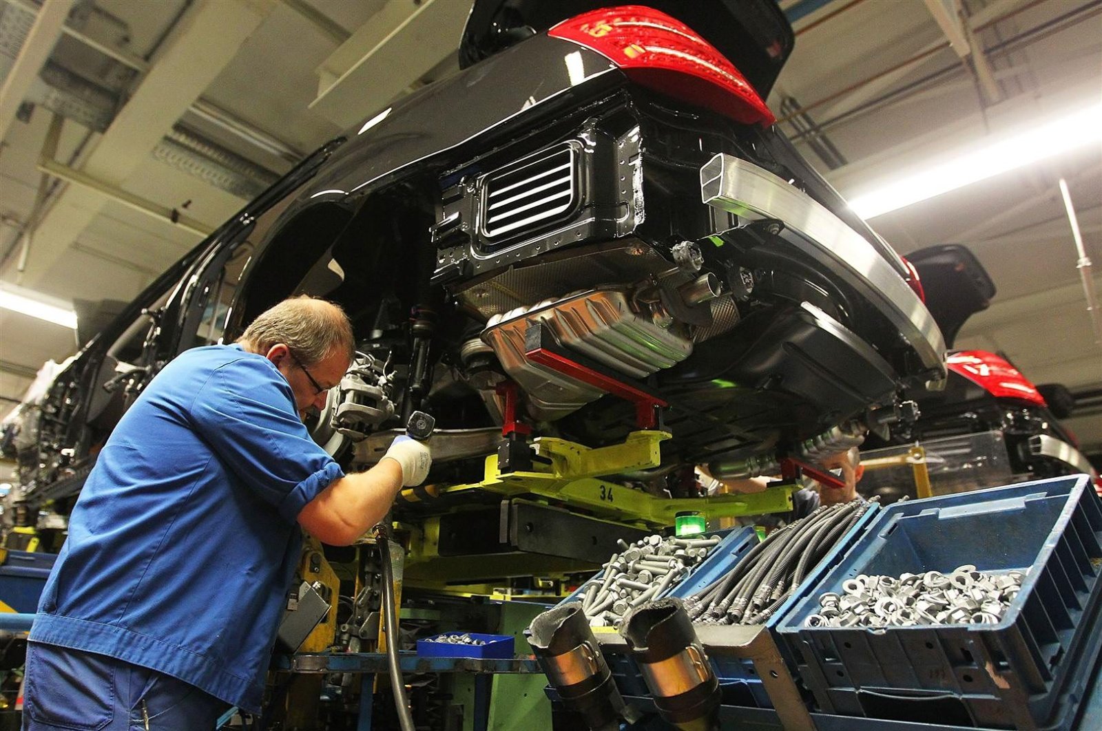 An employee works on a Daimler AG Mercedes-Benz S-Class vehicle on the production line in Sindelfingen, Germany, Jan. 30, 2012. (Getty Images)
