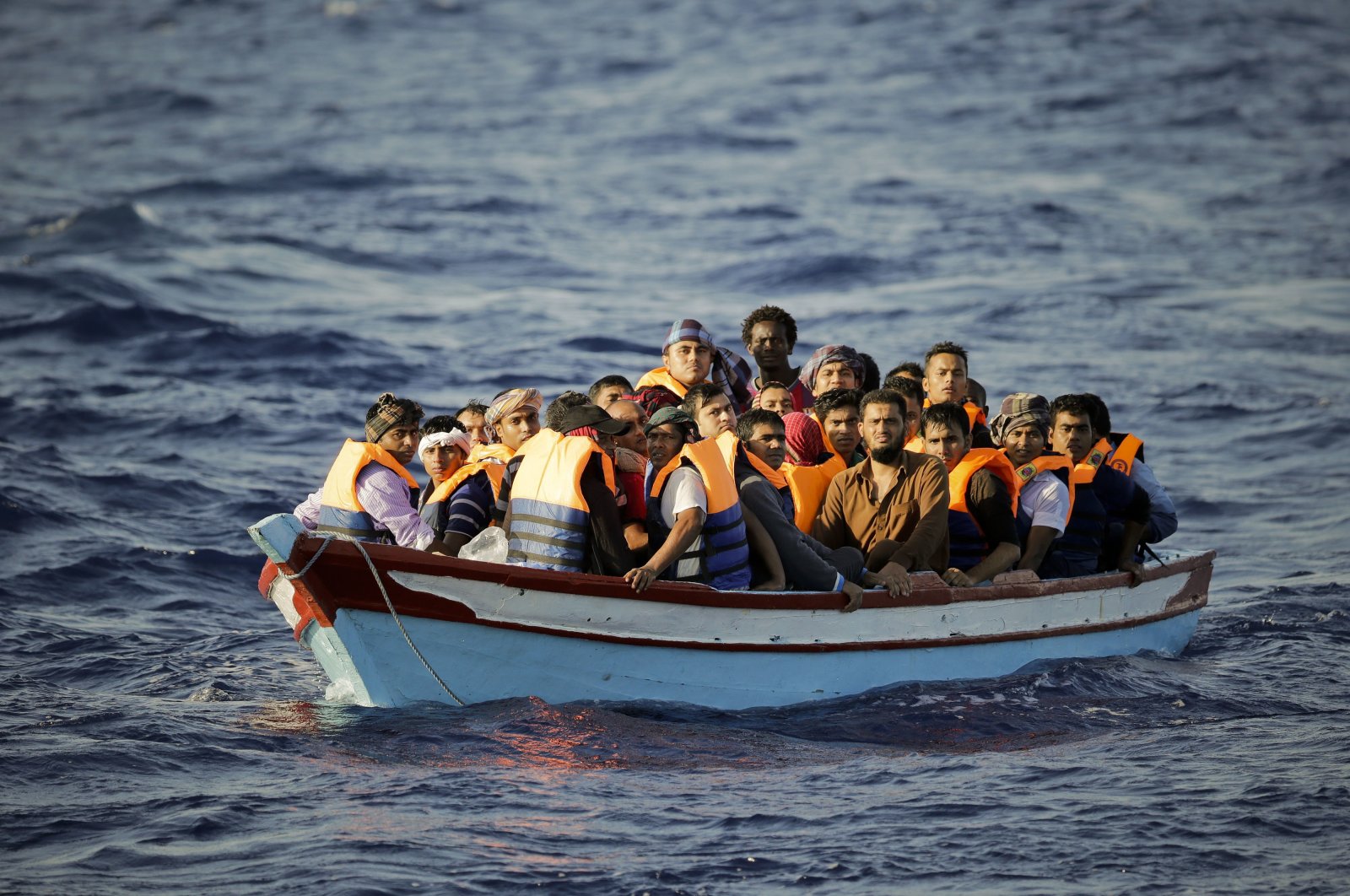 A boat carrying irregular migrants are seen in the Aegean Sea, Dec. 3, 2020. (IHA Photo)