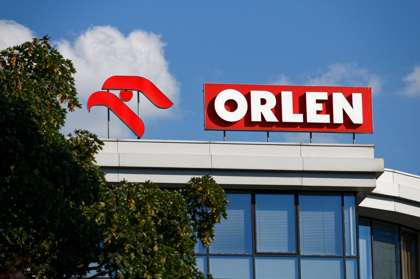 Logo of the PKN Orlen on the top of a building, Warsaw, Poland, July 4, 2018. (Shutterstock Photo by Mateusz Szymanski)