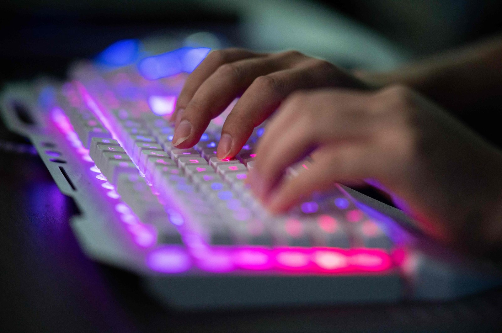 A member of the hacking group Red Hacker Alliance who refused to give his real name uses his computer at their office in Dongguan, southern Guangdong province, China, Aug. 04, 2020. (AFP Photo)