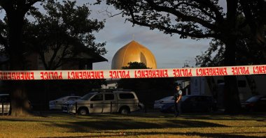 A police officer stands guard in front of the Masjid Al Noor mosque in Christchurch, New Zealand, where one of two mass shootings occurred, March 17, 2019. (AP Photo)