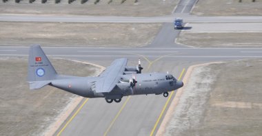 A Turkish C130 military transportation aircraft seen before landing in Kahramankazan district of the capital Ankara, Turkey, Dec. 8, 2020. (Photo by TAI via AA)