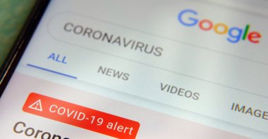 The word "coronavirus" in a Google search box on a smartphone screen, in Stone, England, April 4, 2020. (Shutterstock Photo)