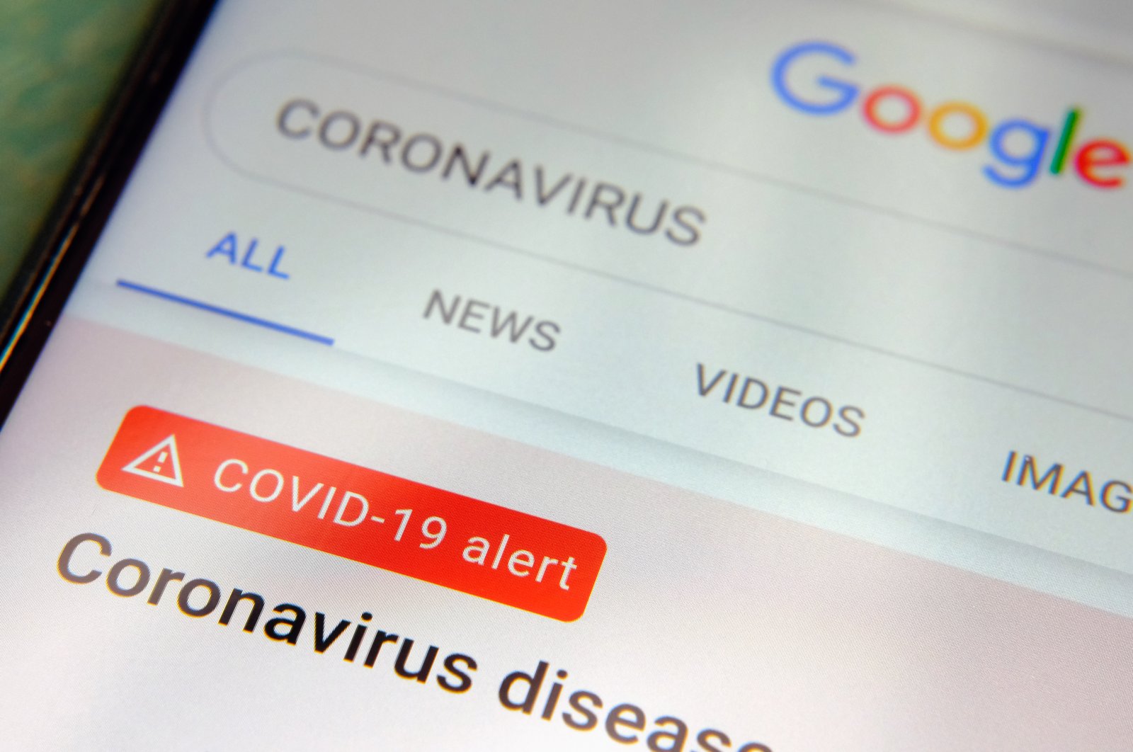 The word "coronavirus" in a Google search box on a smartphone screen, in Stone, England, April 4, 2020. (Shutterstock Photo)