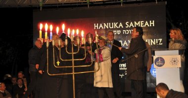 Chief Rabbi Isak Haleva and others light a menorah during a Hanukkah celebration in Istanbul, Turkey, Dec. 10, 2018. (DHA Photo)