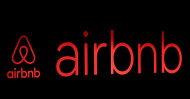 The logos of Airbnb are displayed at an Airbnb event in Tokyo, Japan, June 14, 2018. (Reuters Photo)