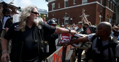A white supremacist grabs a counter protesters' sign during a rally in Charlottesville, Virginia, U.S., Aug. 12, 2017. (Reuters Photo)