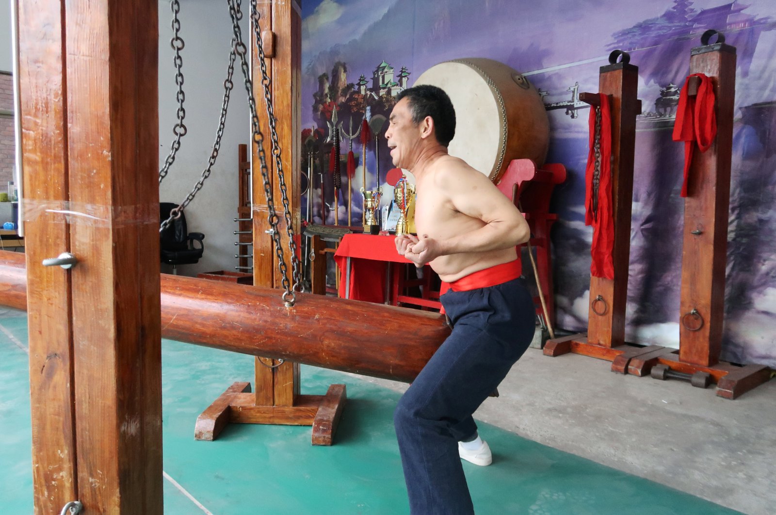 Wang Liutai demonstrates "iron crotch kung fu" at his martial arts academy in the Juntun village of Luoyang, China, Dec. 5, 2020. (Reuters Photo)