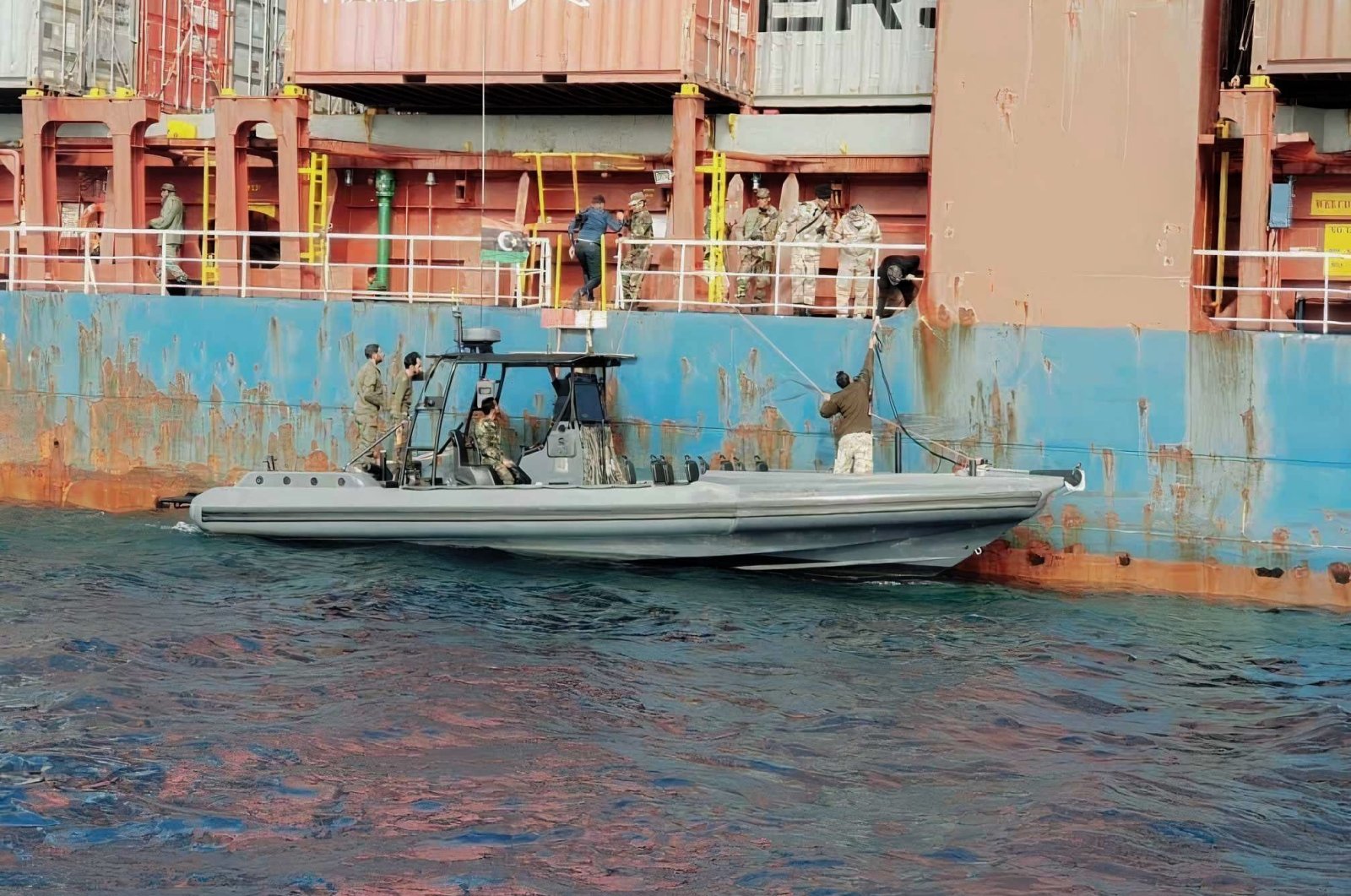 Forces linked to putschist Gen. Khalifa Haftar board a Turkish ship off the Libyan coast, Dec. 08, 2020. (AA Photo)