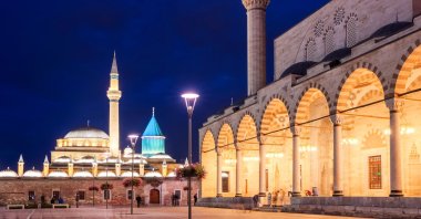 The central square of the old town of Konya with the Mevlana Museum in the background and Selimiye Mosque at night. (Shutterstock Photo)