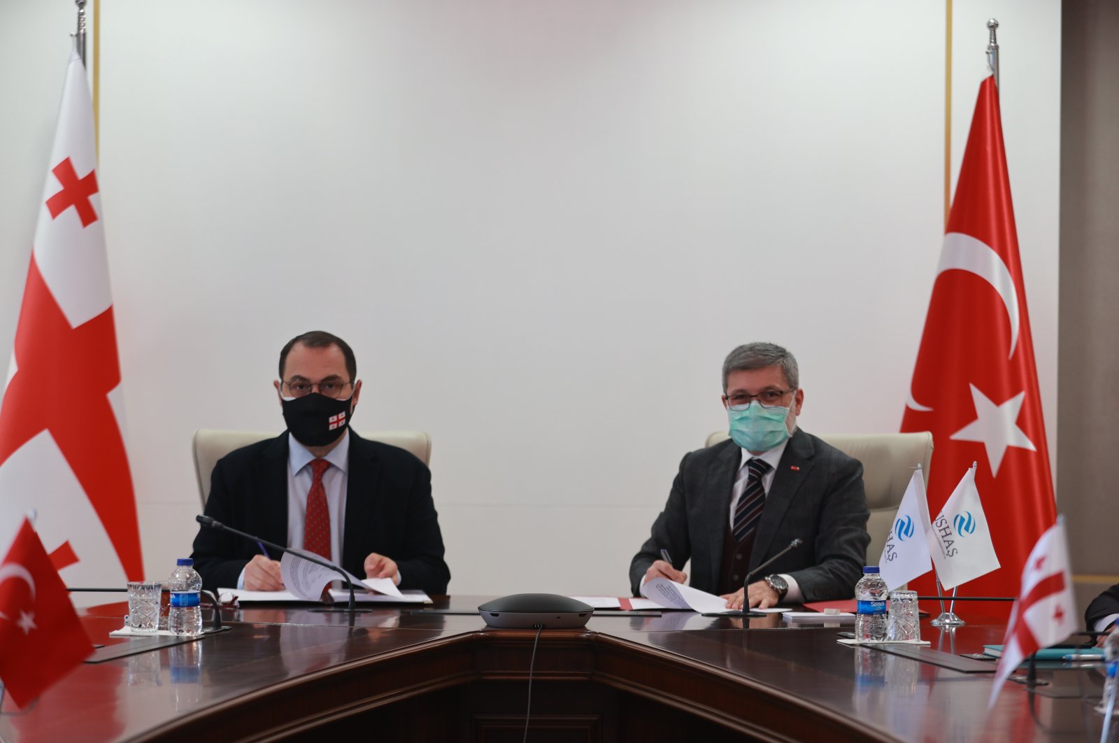 Georgia's Ambassador to Ankara George Janjgava (L) and USHAŞ Chairperson Salih Kenan Şahin attend the signing ceremony of the cooperation protocol, in the capital Ankara, Turkey, Dec. 11, 2020. (AA Photo)