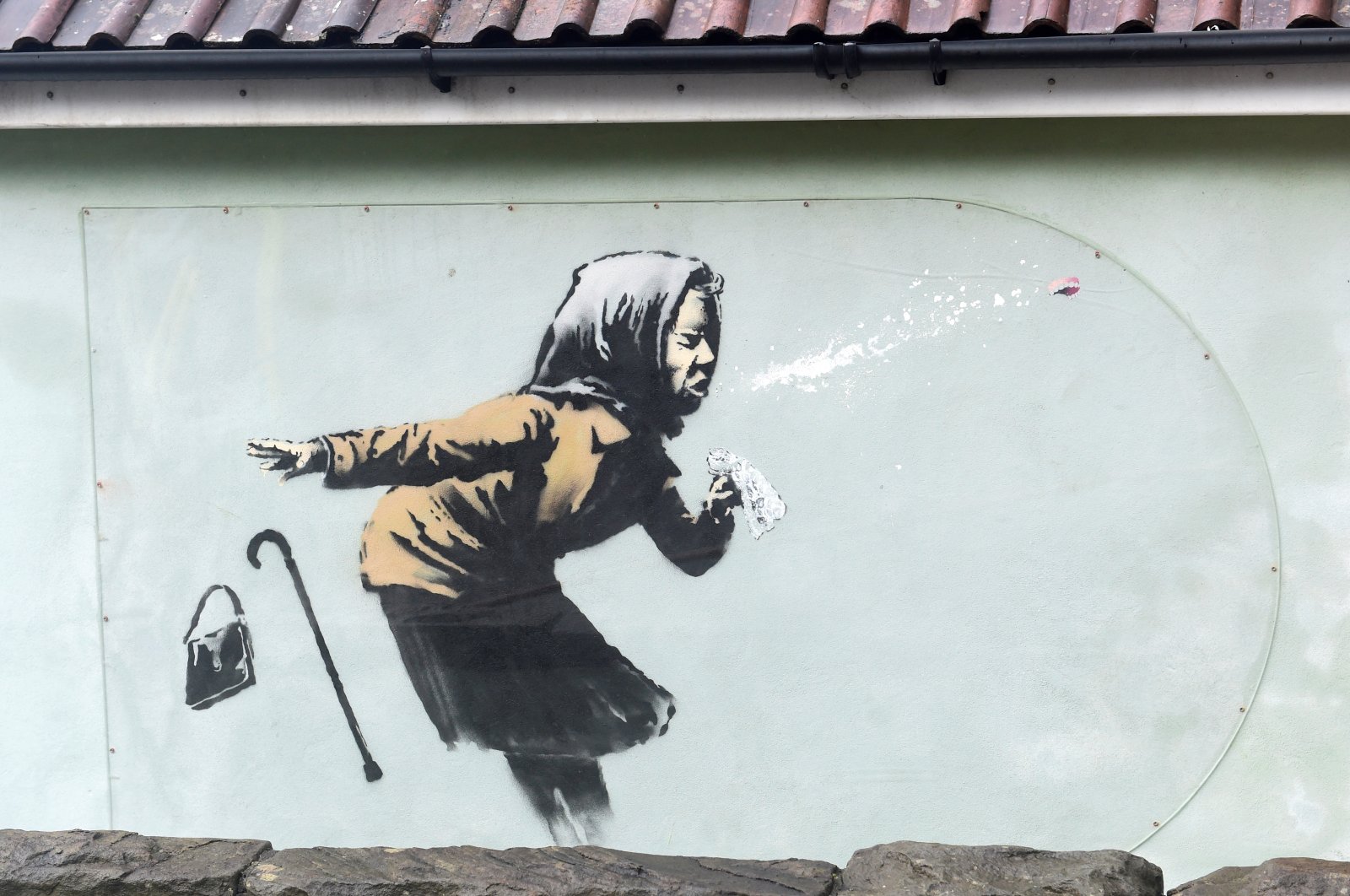 A new street artwork entitled "Aachoo!!" by Banksy is seen in Totterdown, Bristol, Britain, Dec. 11, 2020. (REUTERS Photo)