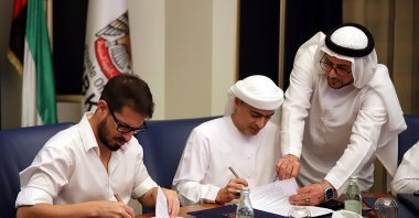 A handout photo made available by Beitar Jerusalem Club shows Moshe Hogeg (L), soccer club owner of Beitar Jerusalem, and Sheikh Hamad bin Khalifa Al Nahyan (R) during the signing of a partnership agreement between the Beitar Jerusalem soccer club and Sheikh Hamad bin Khalifa Al Nahyan, in Dubai, 08 December 2020. (EPA Photo)