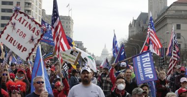 With the U.S. Capitol building in the background, supporters of President Donald Trump demonstrate during a rally at Freedom Plaza in Washington, D.C., Dec. 12, 2020. (AP Photo)