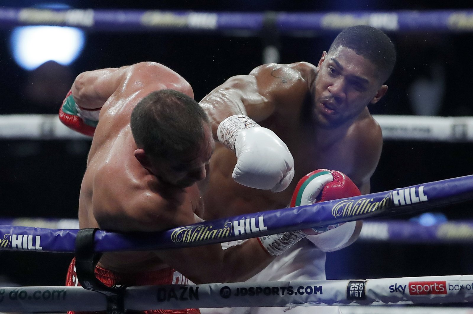 Anthony Joshua lands a blow on Kubrat Pulev during their title fight at Wembley Arena in London, Britain, Dec. 12, 2020. (AP Photo)
