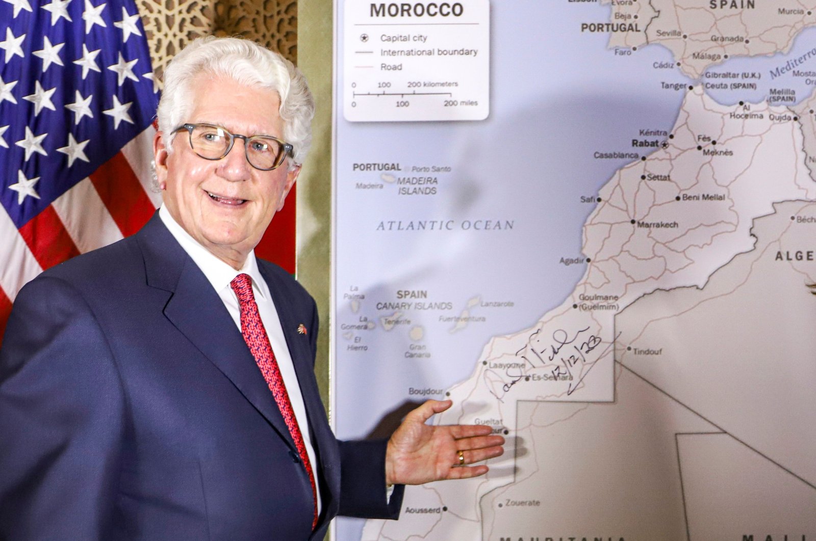 David T. Fischer, U.S. ambassador to the Kingdom of Morocco, stands in front of a U.S. State Department-authorized map of Morocco recognizing the internationally disputed territory Western Sahara as a part of the North African kingdom, in the capital Rabat, Morocco, Dec. 12, 2020. (AFP Photo)