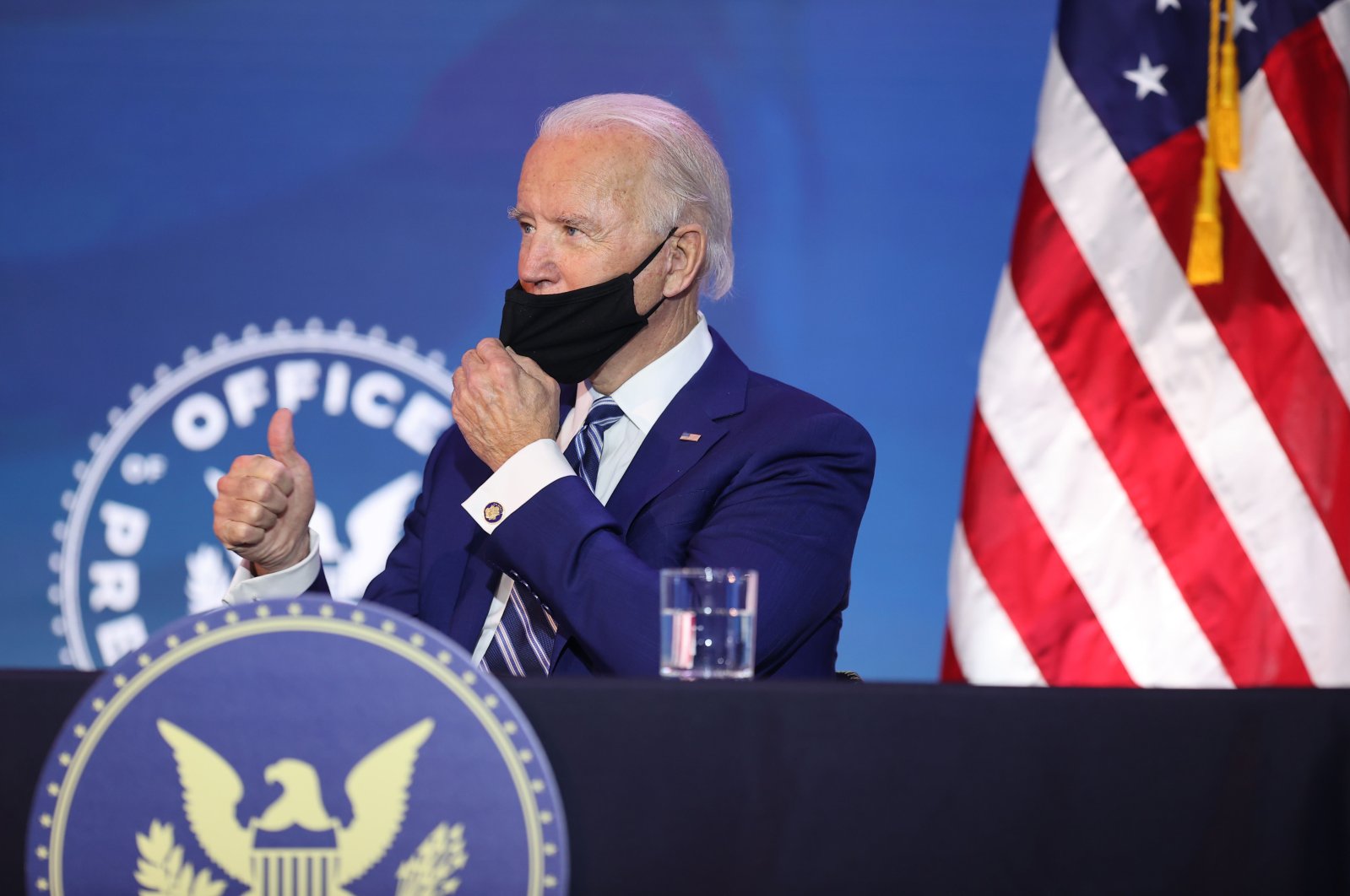 U.S. President-elect Joe Biden gives the thumbs-up as he adjusts his mask during a meeting in Wilmington, Delaware, the U.S., Dec. 9, 2020. (AFP Photo)