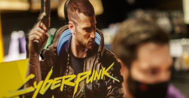 A promo of Cyberpunk 2077, the most anticipated game of 2020, is seen at the entrance to a video game store in Moscow, Russia, Dec. 10, 2020. (Photo by SOPA Images/Sipa USA via Reuters)