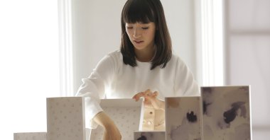 In this July 11, 2018 photo, Japanese organizational expert Marie Kondo displays her line of storage boxes during a media event in New York. (AP Photo)