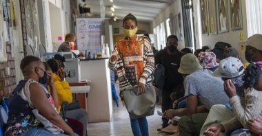 Volunteers wait to be checked at a vaccine trial facility for AstraZeneca at Soweto's Chris Sani Baragwanath Hospital outside Johannesburg, South Africa, Nov. 30, 2020. (AP Photo)