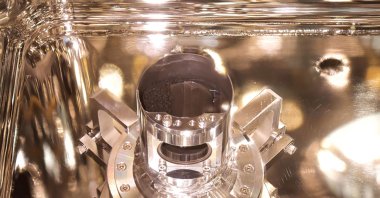 This handout photograph released by the Japan Aerospace Exploration Agency (JAXA) on Dec. 15, 2020, shows samples of surface dust and pristine material collected from the asteroid Ryugu by the Hayabusa-2 space probe, at the JAXA Sagamihara Campus in Sagamihara, Japan. (Handout photo provided by JAXA via AFP)