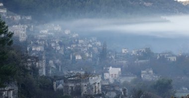 Abandoned buildings seen through fog in Kayaköy, Muğla province, Dec. 11, 2020. (AA Photo)