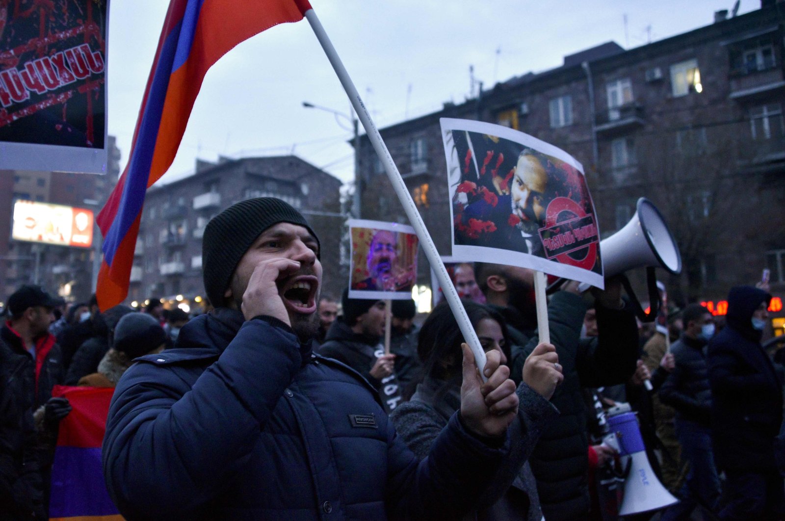 Protesters march through the streets of Yerevan to demand the resignation of Armenian Prime Minister Nikol Pashinian over a controversial peace agreement with Azerbaijan that ended six weeks of war over the formerly occupied Nagorno-Karabakh region, Yerevan, Armenia, Dec. 14, 2020. (AFP Photo)