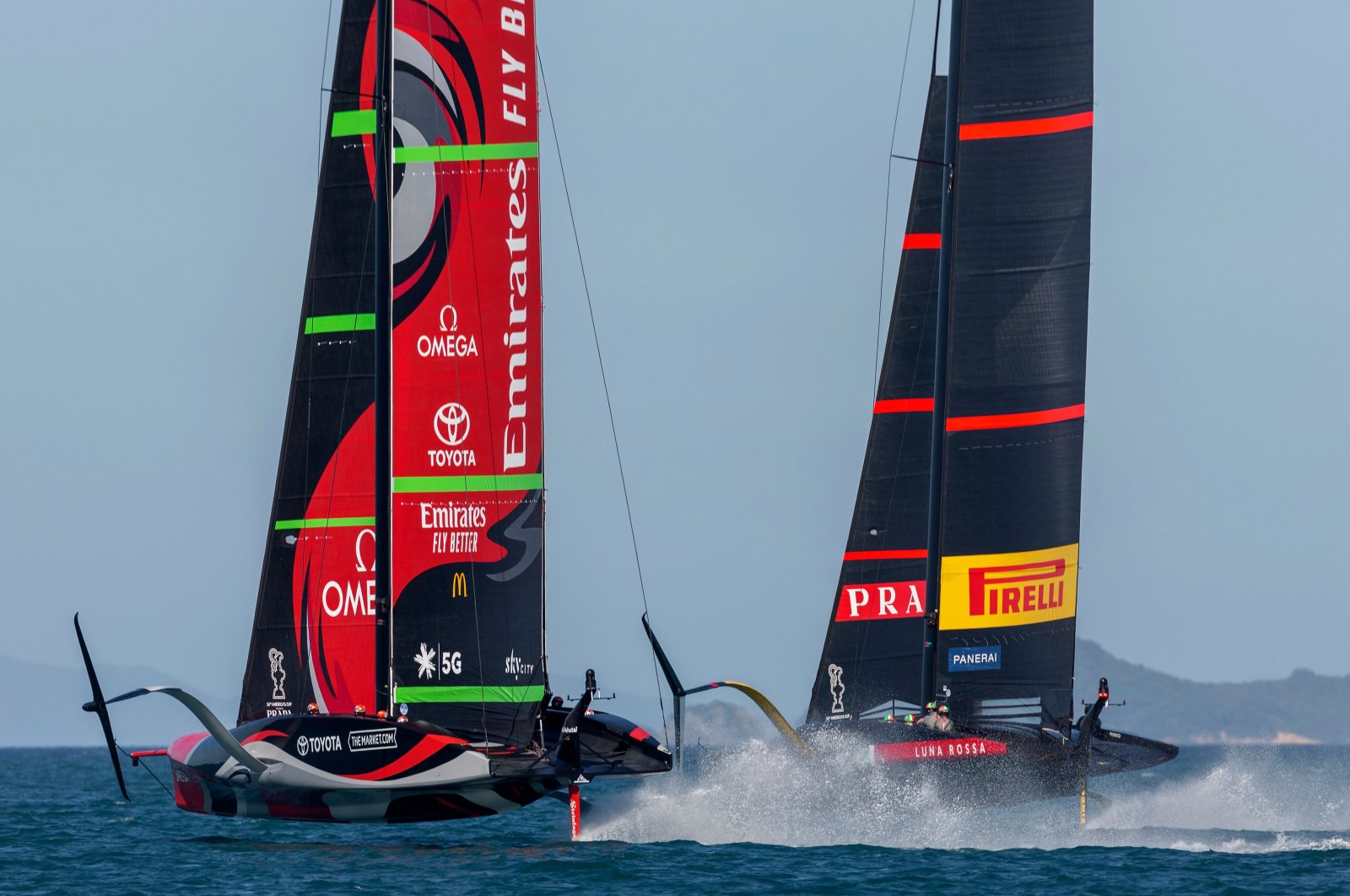 Luna Rossa Prada Pirelli (R) competes against Emirates Team New Zealand on practice racing day, in Auckland, New Zealand, Dec. 15, 2020. (AFP PHOTO)