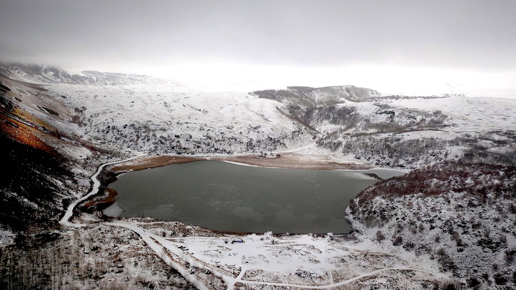 Nemrut Crater Lake covered in a blanket of snow on a winters day in ...