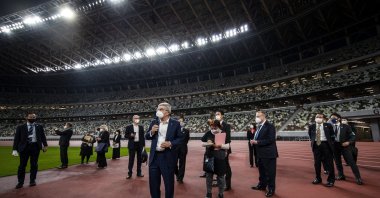 International Olympic Committee (IOC) President Thomas Bach (C) visits the National Stadium, the main venue for the 2020 Olympics, in Tokyo, Japan, Nov. 17, 2020. (AP Photo)
