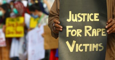 Activists of V-care welfare trust hold placards during a protest against the alleged gang rape of a woman, Karachi, Pakistan, Sept. 13, 2020. (EPA Photo)