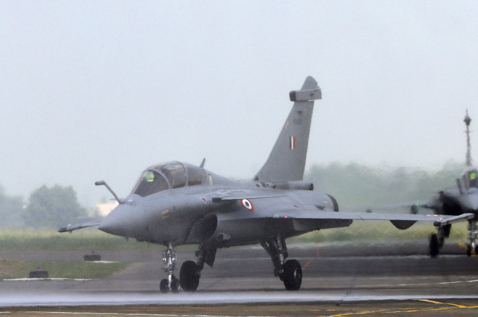 Water is sprayed on a French-made Rafale fighter jet during its induction ceremony at the Indian Air Force Station in Ambala, India, Sept.10, 2020. (AP Photo)