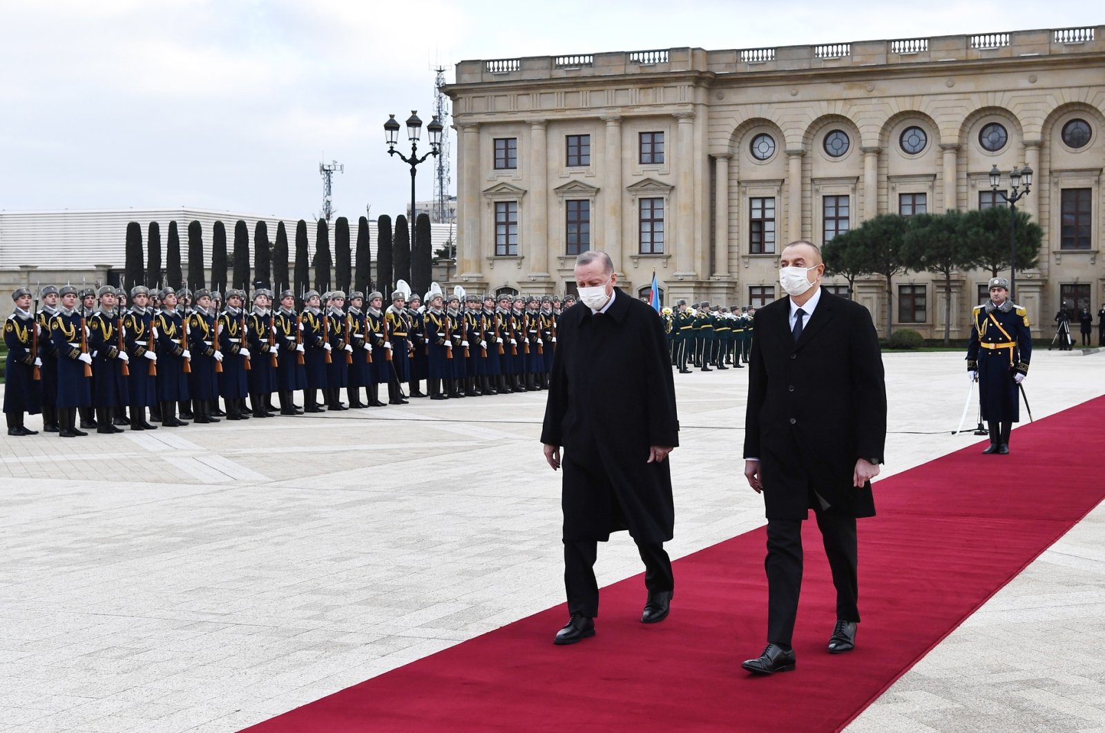 Azerbaijani President Ilham Aliyev (R) and Turkish President Recep Tayyip Erdoğan (L) attend an official welcoming ceremony in Baku, Azerbaijan, Dec. 10, 2020, in this handout photo provided by the Azerbaijan Presidential Press Office. (EPA Photo)