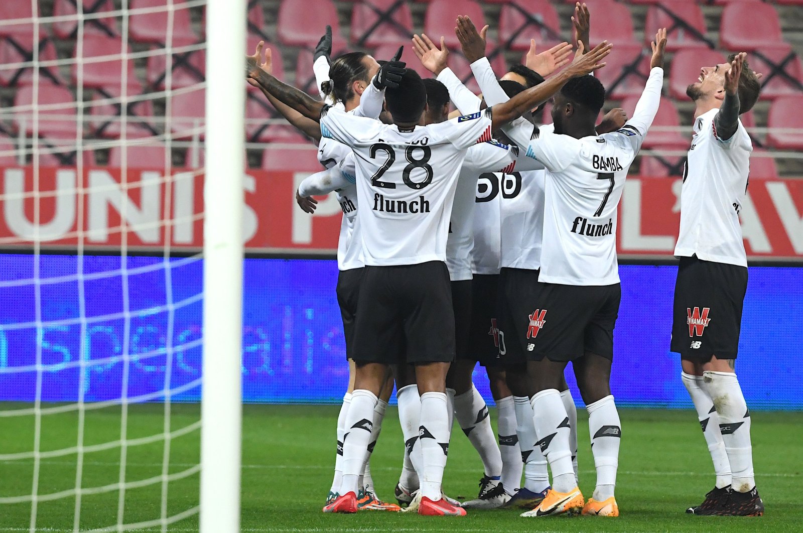 Lille’s players celebrate after Turkish forward Yusuf Yazıcı scored a goal during the French Ligue 1 football match against Dijon at the Gaston Gerard Stadium in Dijon, central France, Dec. 16, 2020. (AFP Photo)