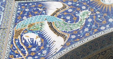 Simurgh mosaic on front of Nadir Divan Begi Madrasah in Bukhara, Uzbekistan.