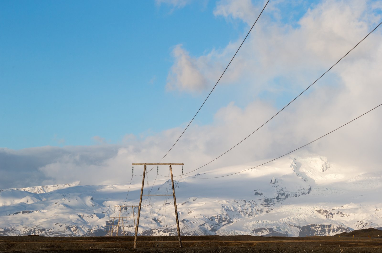 Power lines, electricity pylons and towers supplying ecologically friendly electricity sourced from geothermal energy from deep in the ground stretch across Iceland in this undated photo. (Shutterstock Photo)