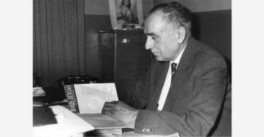 Ahmet Hamdi Başar examines his “Barış Dünyası” journal.