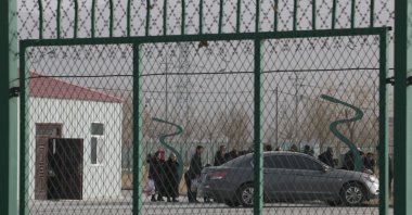People line up in an internment camp, called “vocational skills education training service centers” by the Chinese government, in Artux, Xinjiang Uyghur Autonomous Region, western China, Dec. 3, 2018. (AP Photo)