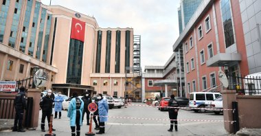 Security personnel stand in front of the SANKO University Hospital following a fire in Gaziantep, Turkey, Dec. 19, 2020. (AA Photo)