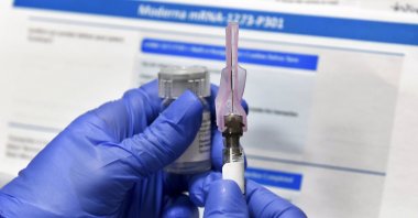 A nurse prepares a shot as a study of a possible COVID-19 vaccine, developed by the National Institutes of Health and Moderna Inc., gets underway in Binghamton, New York, U.S., July 27, 2020. (AP Photo)