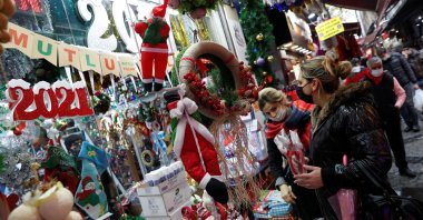 Women wearing protective face masks peruse a store selling Christmas and New Year ornaments, amid the spread of COVID-19, in Istanbul, Turkey, Dec. 16, 2020. (Reuters Photo)
